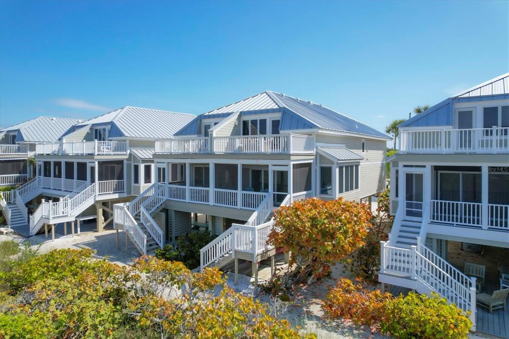 480 Gulf Boulevard, Unit 6 Boca Grande, FL 33921 - Photo 45 of 49 front view of a house with a yard