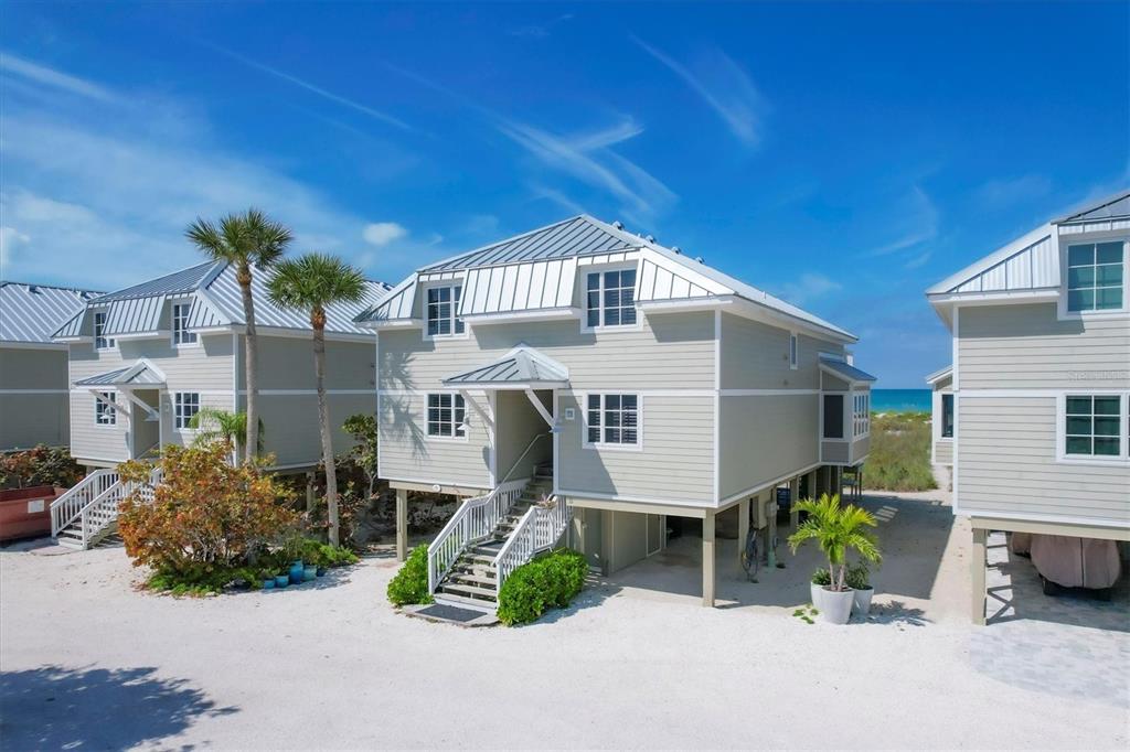 480 Gulf Boulevard, Unit 6 Boca Grande, FL 33921 - Photo 6 of 49 a front view of a house with garden