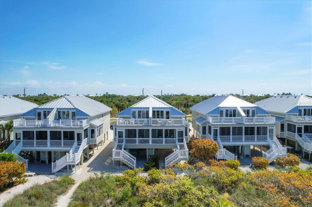 480 Gulf Boulevard, Unit 6 Boca Grande, FL 33921 - Photo 7 of 49 a front view of a house with a porch