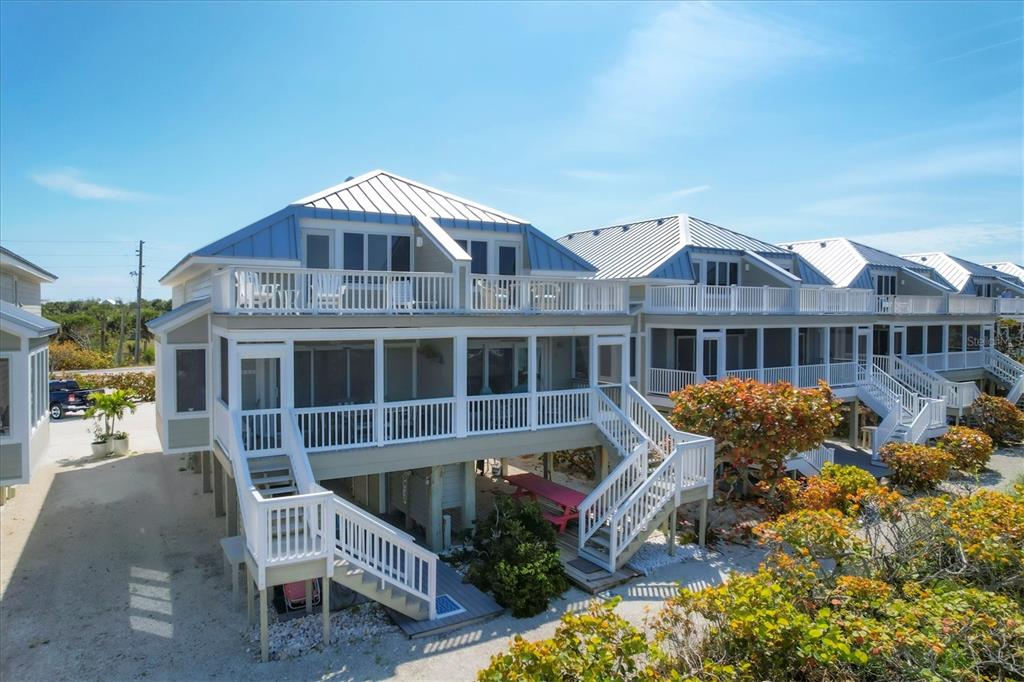 480 Gulf Boulevard, Unit 6 Boca Grande, FL 33921 - Photo 8 of 49 a front view of a house with swimming pool