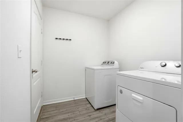 a view of storage and utility room with washer and dryer