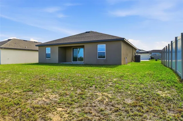 a brick house with a yard