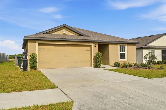 a front view of a house with yard