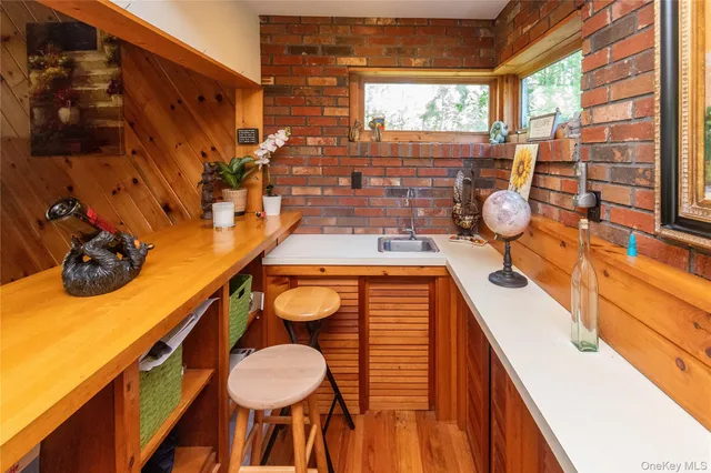 a room with table chairs and a large window
