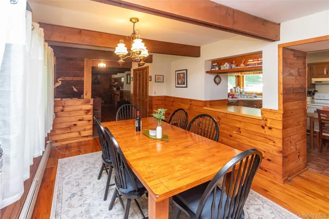 a dining room filled with furniture and window