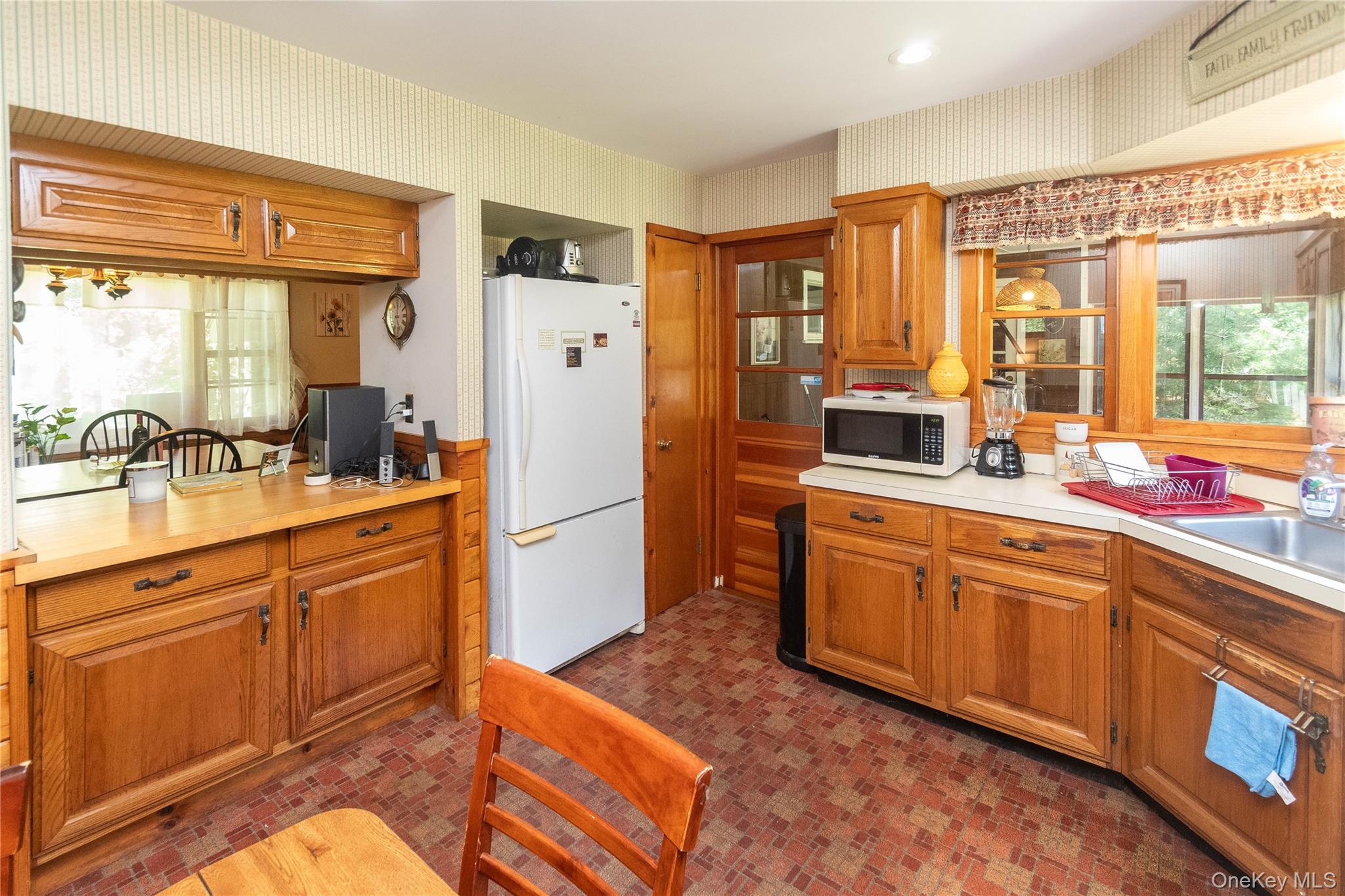 90 Hillside Road Barryville, NY 12719 - Photo 20 of 39 a large kitchen with kitchen island a large window a sink stainless steel appliances and cabinets