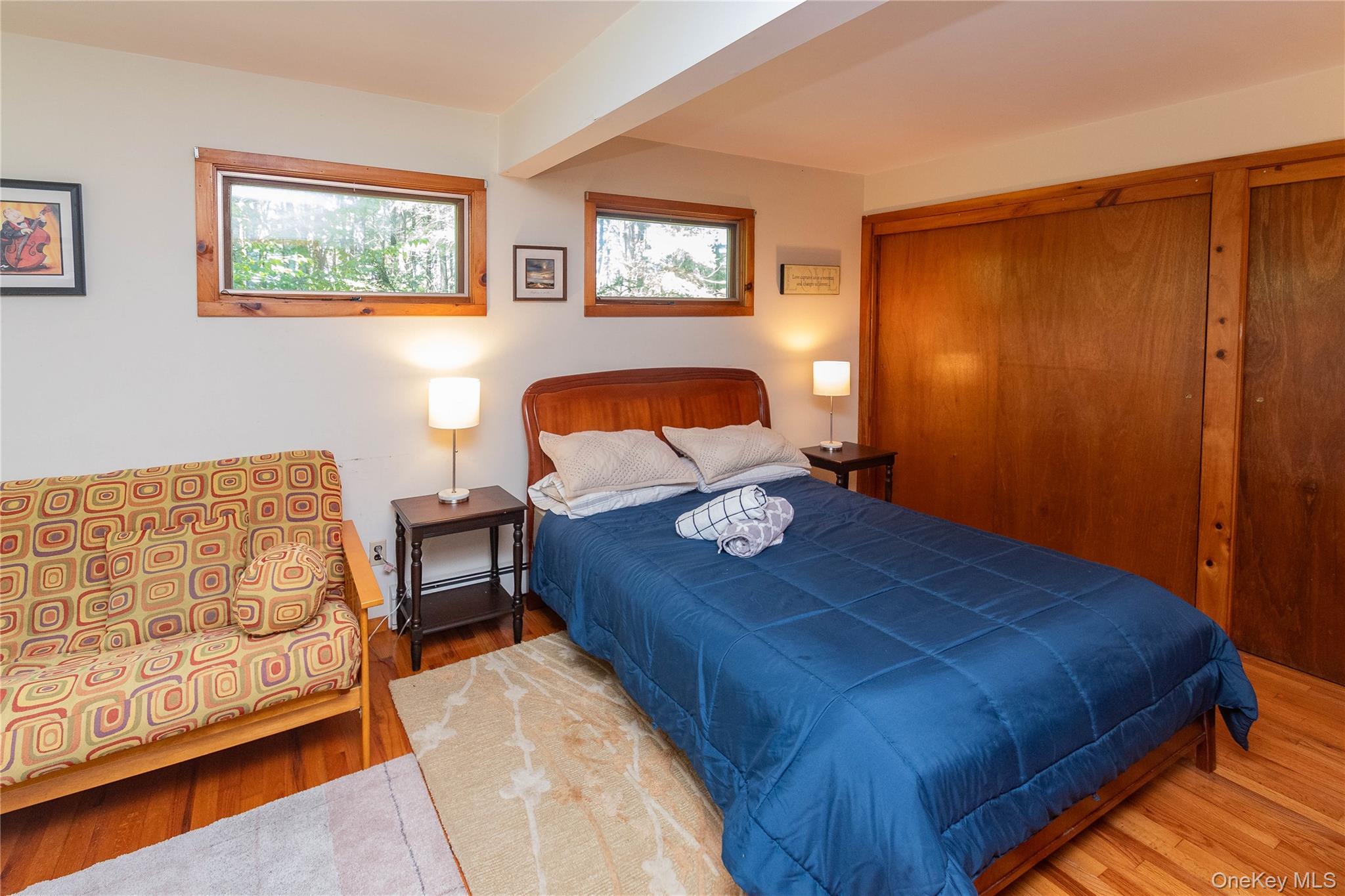 90 Hillside Road Barryville, NY 12719 - Photo 21 of 39 a bed sitting in a bedroom next to a window