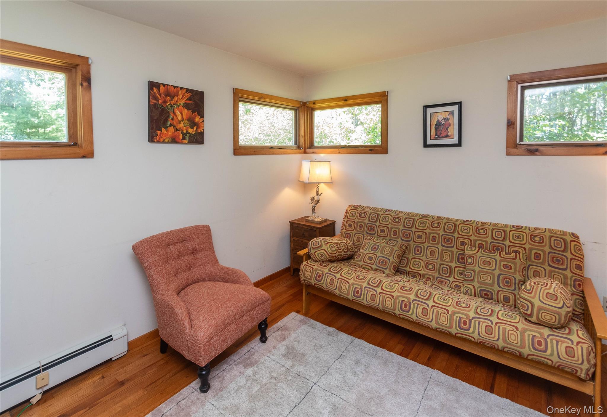 90 Hillside Road Barryville, NY 12719 - Photo 22 of 39 a living room with furniture and a window
