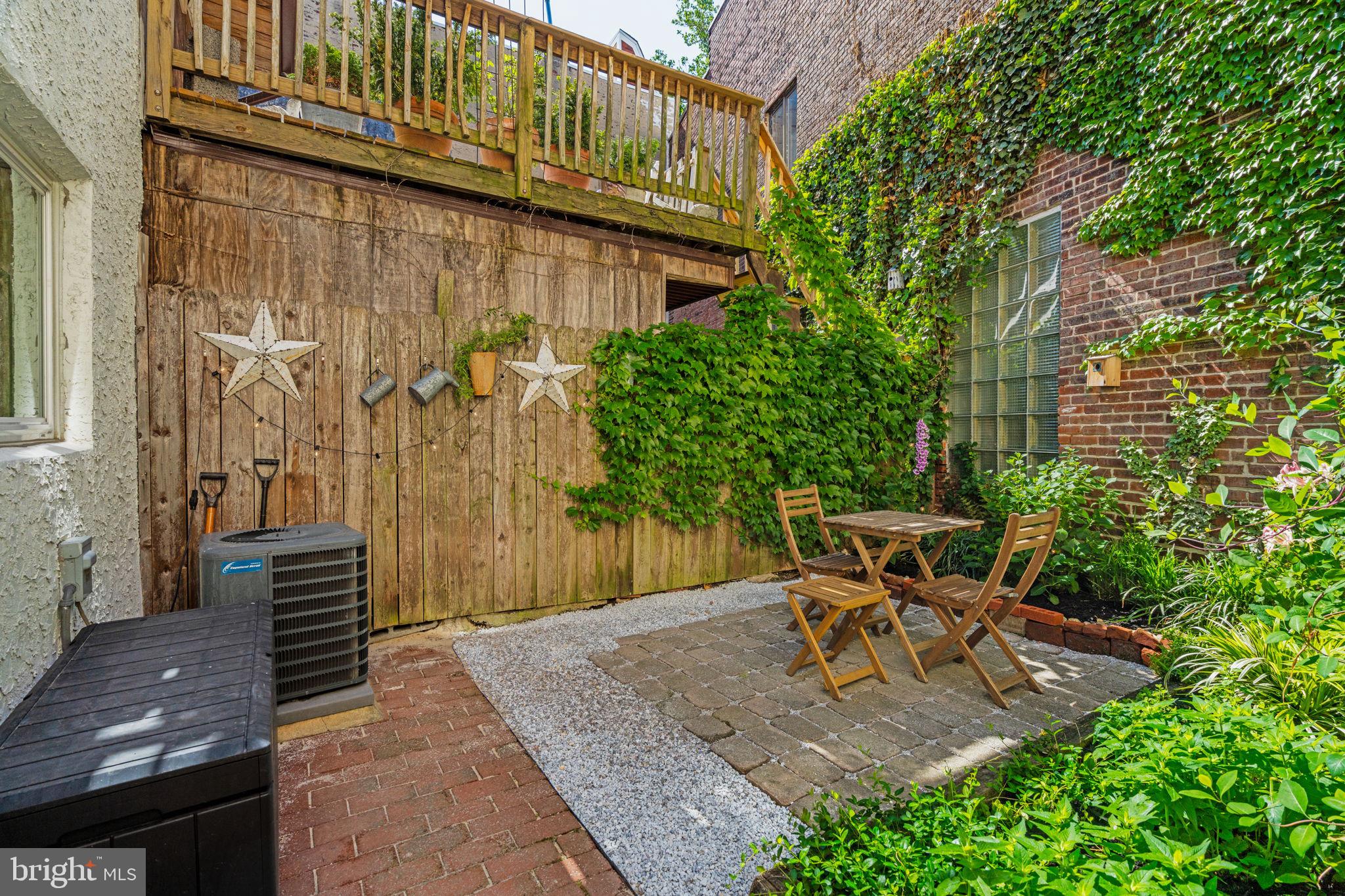 142 Carpenter Street Philadelphia, PA 19147 - Photo 19 of 49 a view of a chair and table in backyard of the house