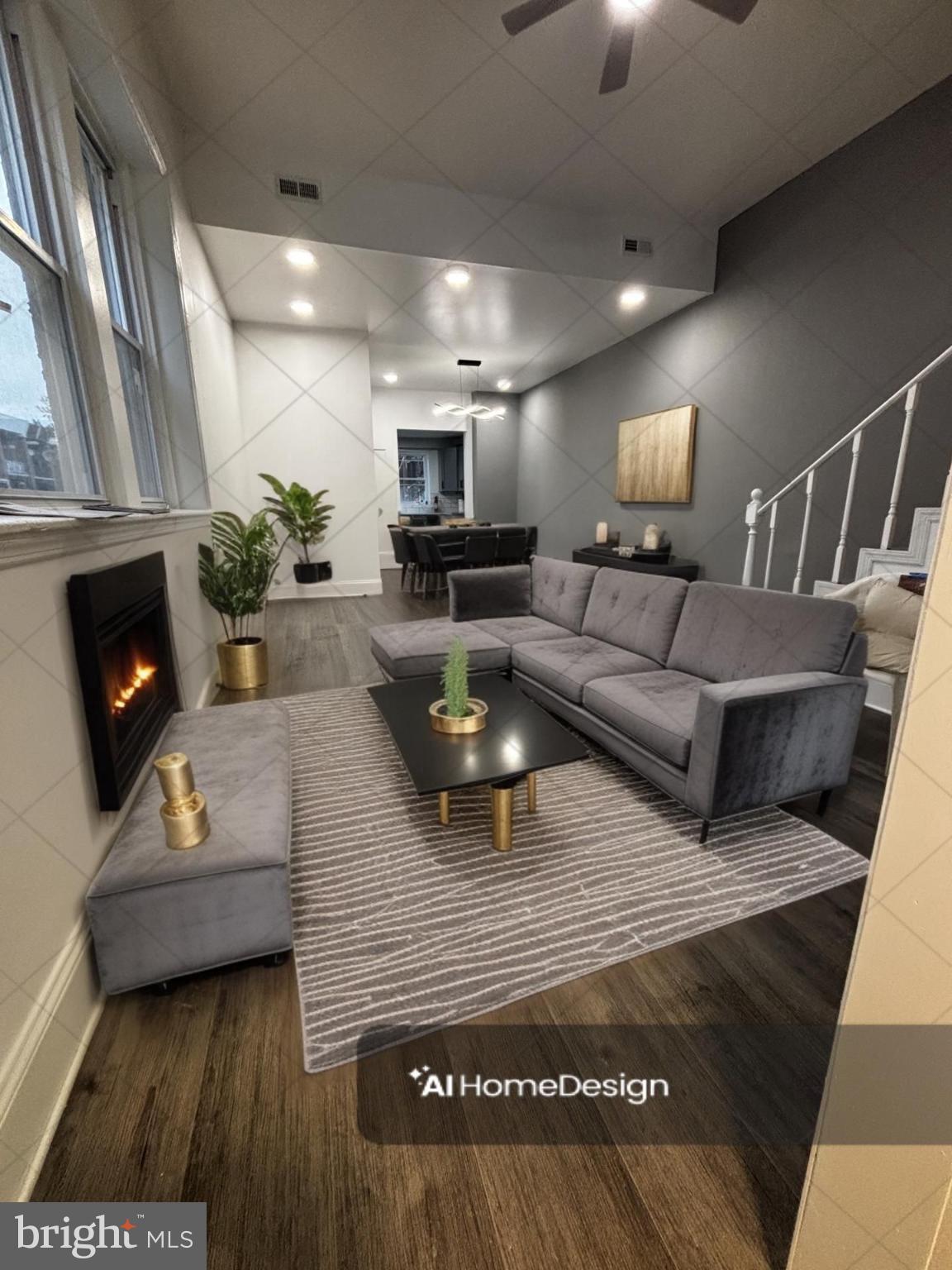 a living room with furniture and a fireplace