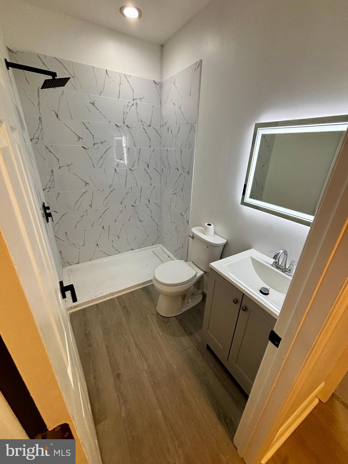 901 South 60th Street Philadelphia, PA 19143 - Photo 17 of 20 a bathroom with a sink a toilet and shower