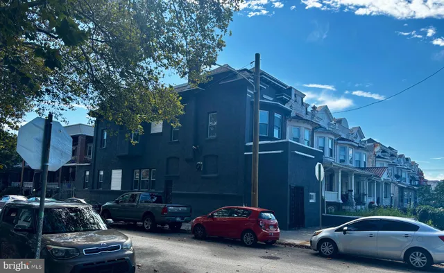 a car parked in front of a house