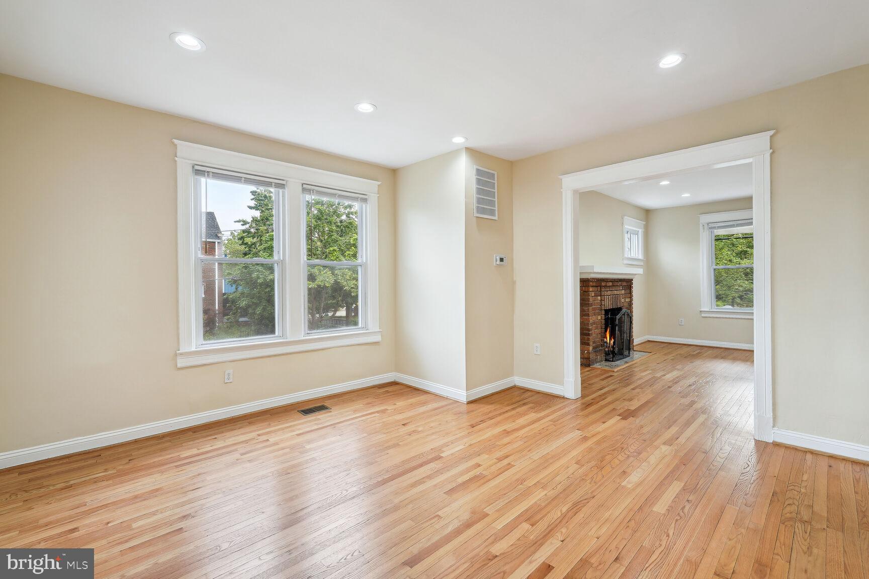 4528 4th Street Northwest Washington, DC 20011 - Photo 6 of 28 a view of an empty room with wooden floor and a window
