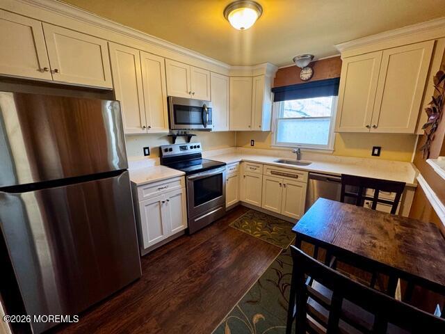 4 Dogwood Road Manahawkin, NJ 08050 - Photo 11 of 28 a kitchen with stainless steel appliances a stove a sink a refrigerator cabinets and a dining table