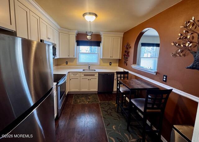 4 Dogwood Road Manahawkin, NJ 08050 - Photo 12 of 28 a kitchen with stainless steel appliances granite countertop a refrigerator a sink dishwasher a stove and white countertops with wooden floor