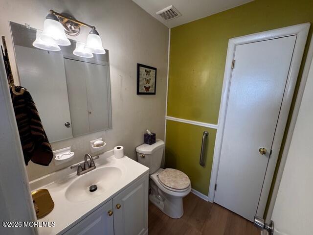4 Dogwood Road Manahawkin, NJ 08050 - Photo 16 of 28 a bathroom with a sink a toilet and mirror
