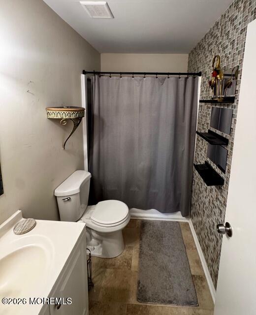 4 Dogwood Road Manahawkin, NJ 08050 - Photo 20 of 28 a bathroom with a toilet and shower