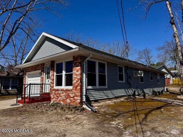 4 Dogwood Road Manahawkin, NJ 08050 - Photo 2 of 28 a front view of a house with basket ball court and outdoor seating