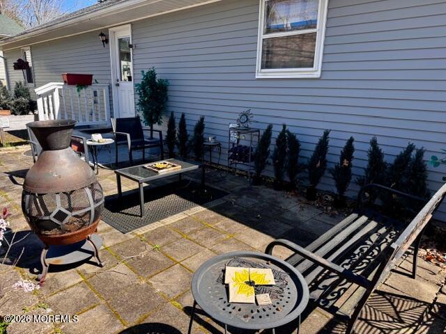 4 Dogwood Road Manahawkin, NJ 08050 - Photo 24 of 28 a view of a chairs and tables in patio