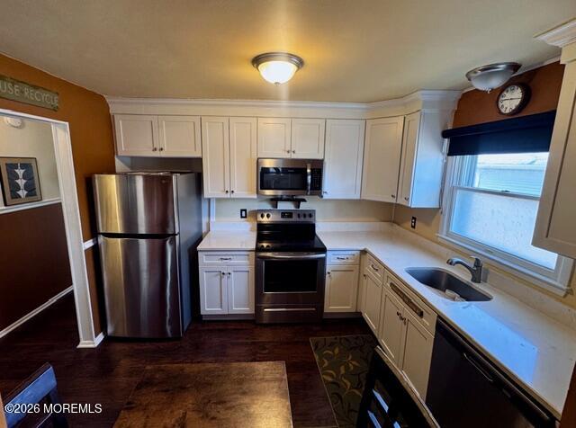 4 Dogwood Road Manahawkin, NJ 08050 - Photo 10 of 28 a kitchen with a refrigerator and a stove