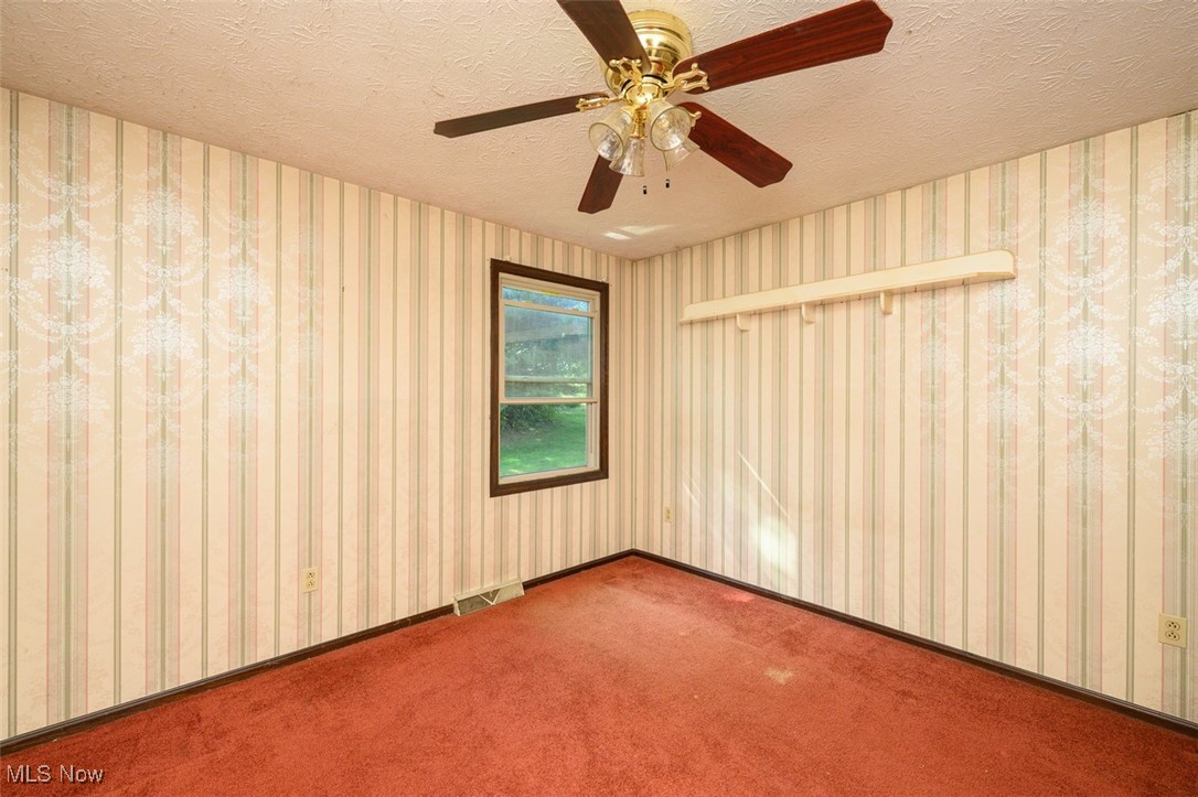 8838 Timberlink Road Northwest Canal Fulton, OH 44614 - Photo 14 of 30 Bedroom with ceiling fan and carpet flooring