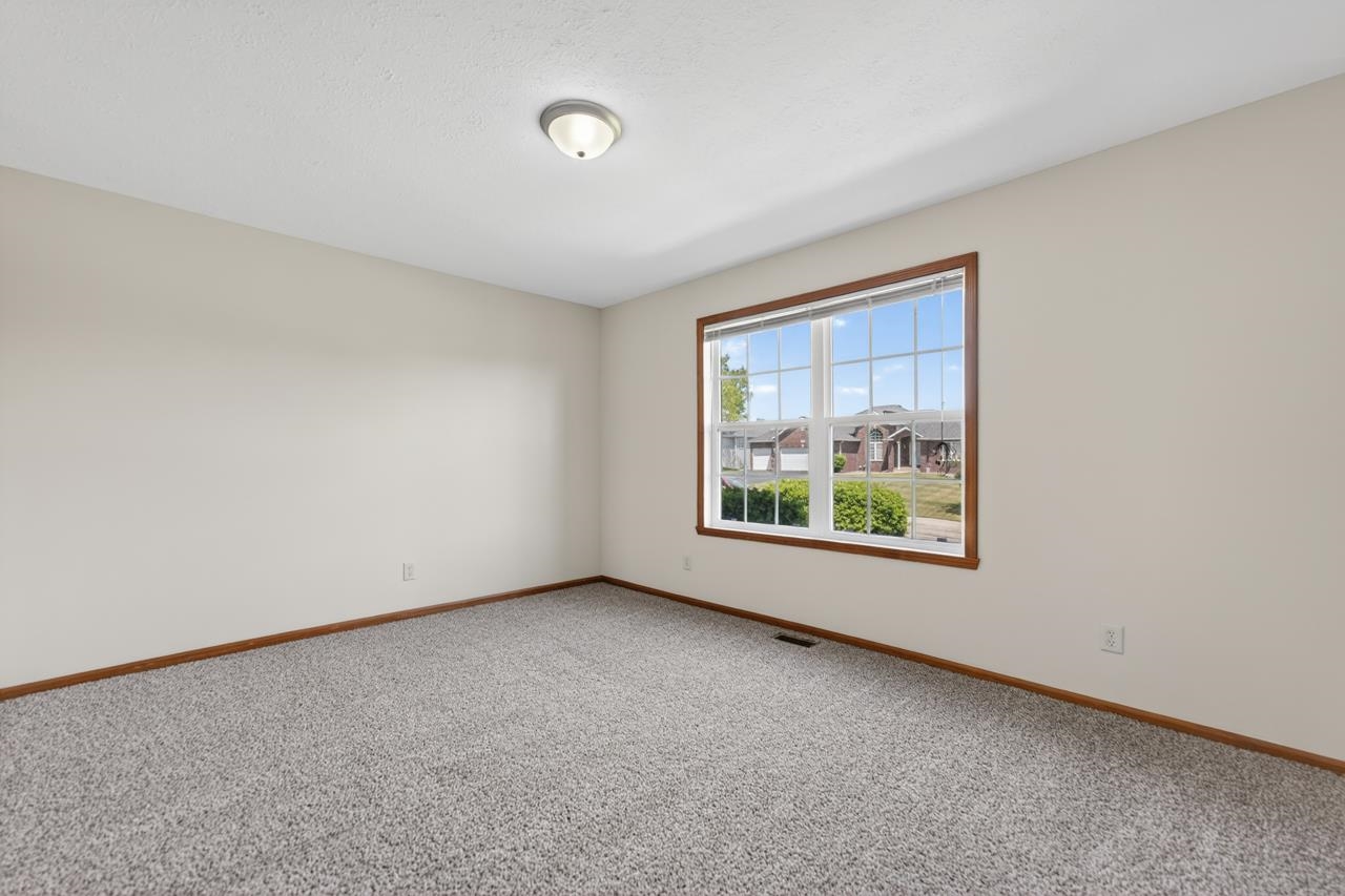 676 Elberon Way Roscoe, IL 61073 - Photo 4 of 30 an empty room with windows