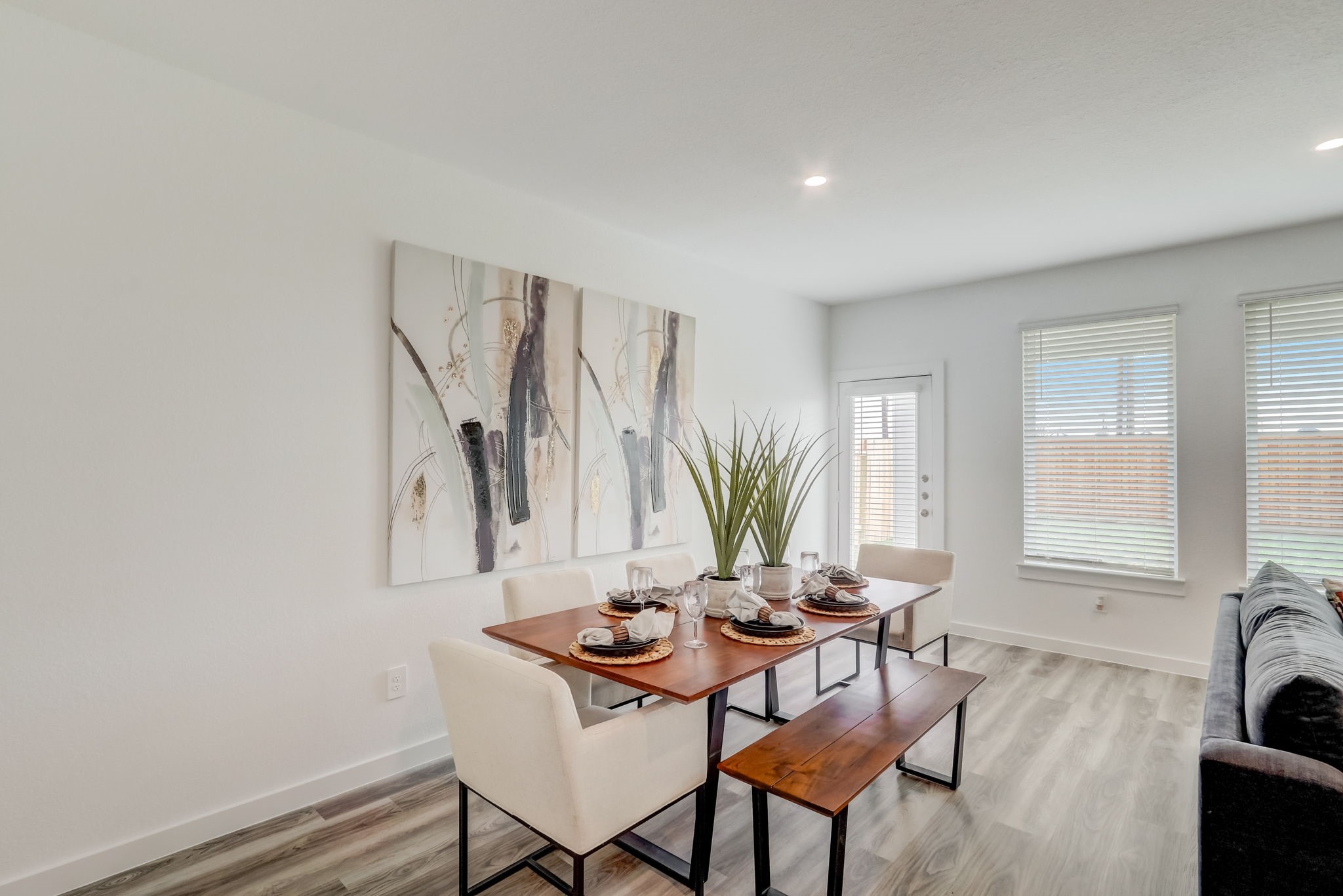 2631 Callahan Springs Lane Houston, TX 77051 - Photo 11 of 50 a view of a dining room with furniture and a potted plant