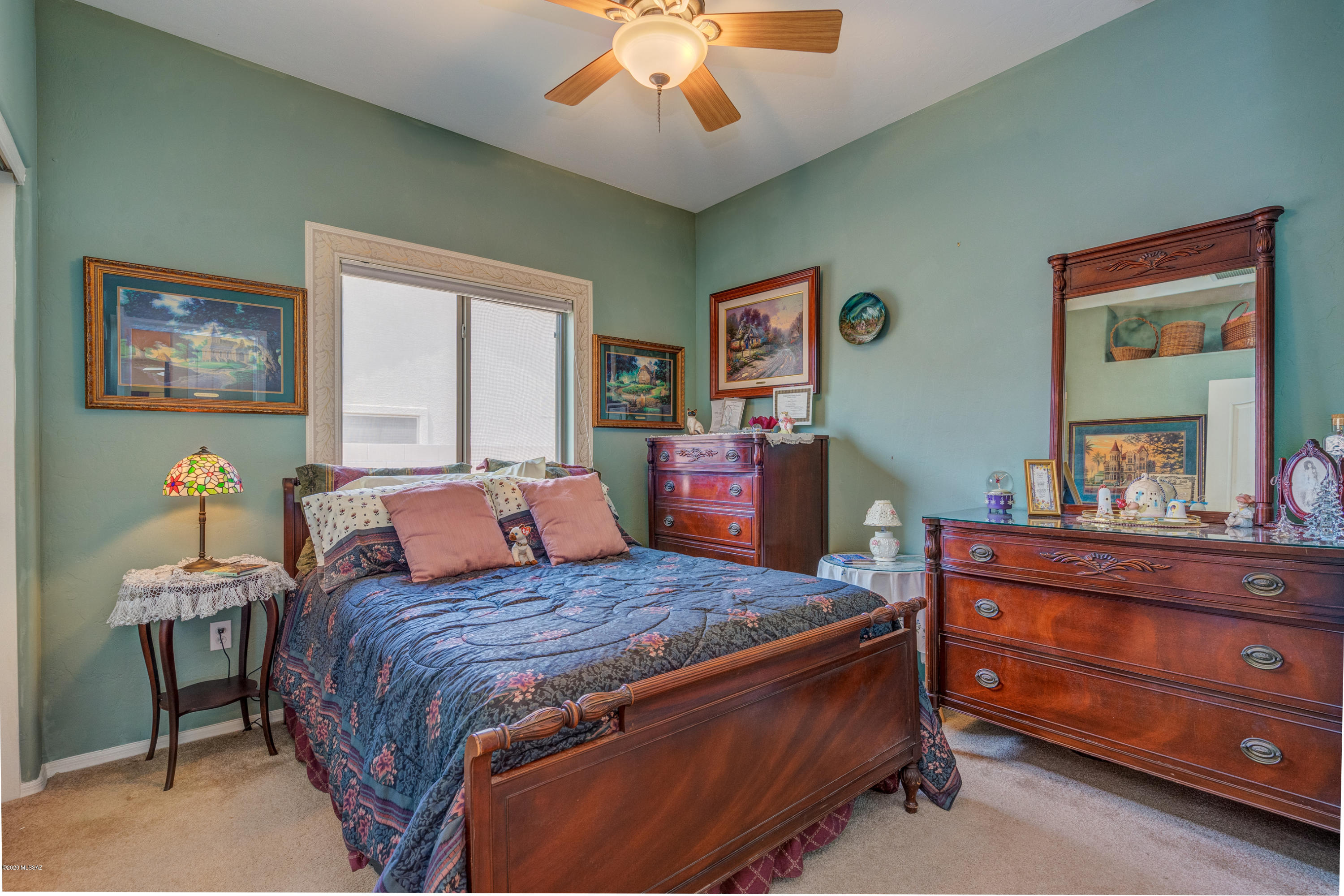 3640 East Northern Dancer Road Tucson, AZ 85739 - Photo 30 of 47 a bedroom with a bed and a dresser in it
