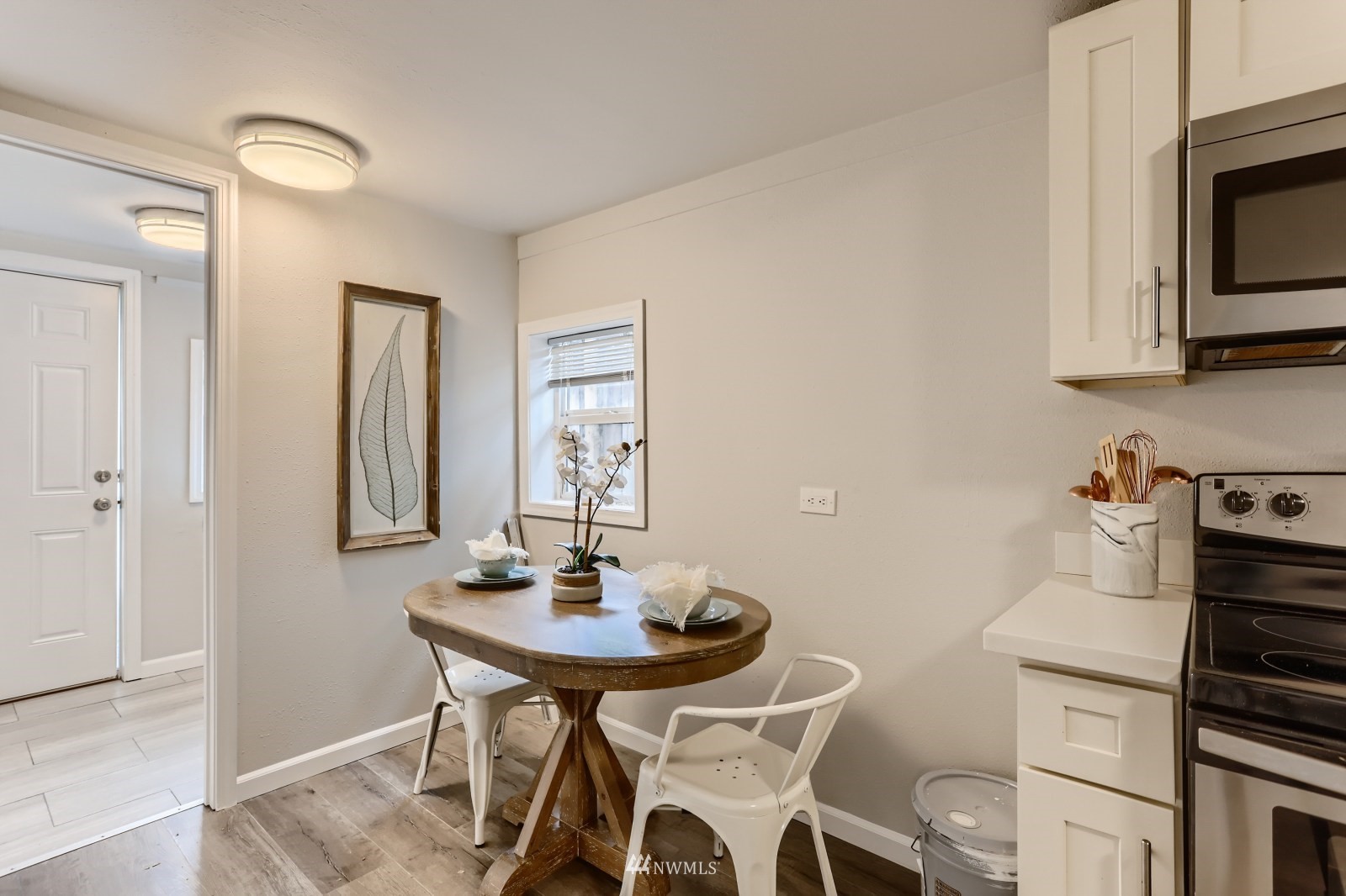 3524 South Brandon Street Seattle, WA 98118 - Photo 6 of 14 a kitchen with a sink cabinets and appliances