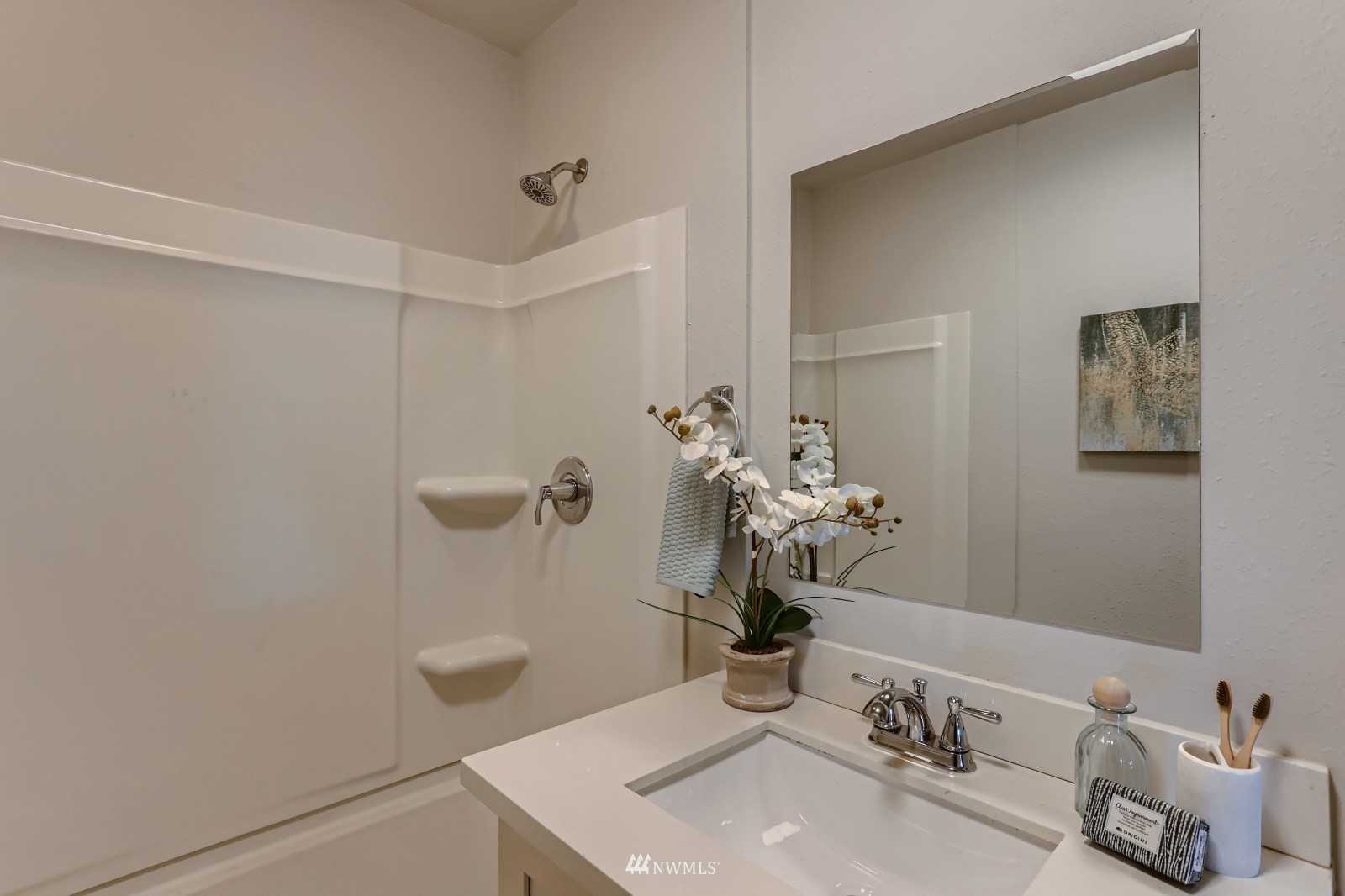 3524 South Brandon Street Seattle, WA 98118 - Photo 8 of 14 a bathroom with a sink a toilet and mirror