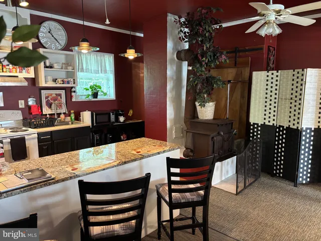 a kitchen with a table and chairs