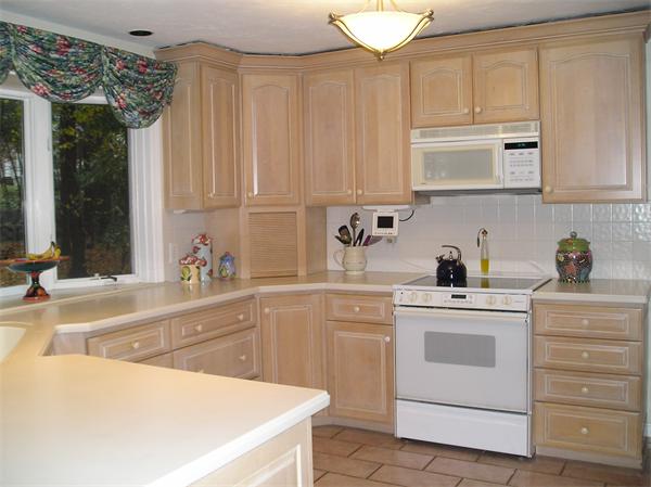 23 Elliott Road Sterling, MA 01564 - Photo 12 of 30 a kitchen with white cabinets and white appliances