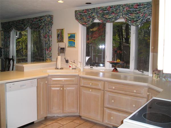 23 Elliott Road Sterling, MA 01564 - Photo 13 of 30 a bathroom with a sink and a large mirror