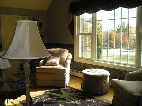 23 Elliott Road Sterling, MA 01564 - Photo 14 of 30 a living room with furniture and a floor to ceiling window