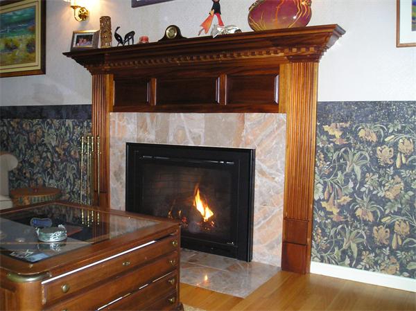23 Elliott Road Sterling, MA 01564 - Photo 16 of 30 a fireplace with a clock on top of it