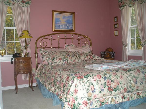 23 Elliott Road Sterling, MA 01564 - Photo 24 of 30 a bed sitting in a bedroom next to a window