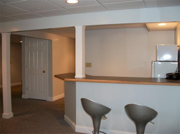 23 Elliott Road Sterling, MA 01564 - Photo 28 of 30 a kitchen with a refrigerator and a chair