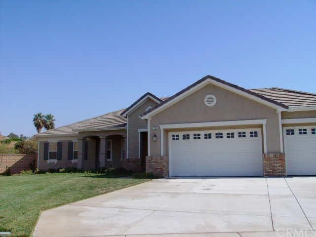 a front view of a house with yard