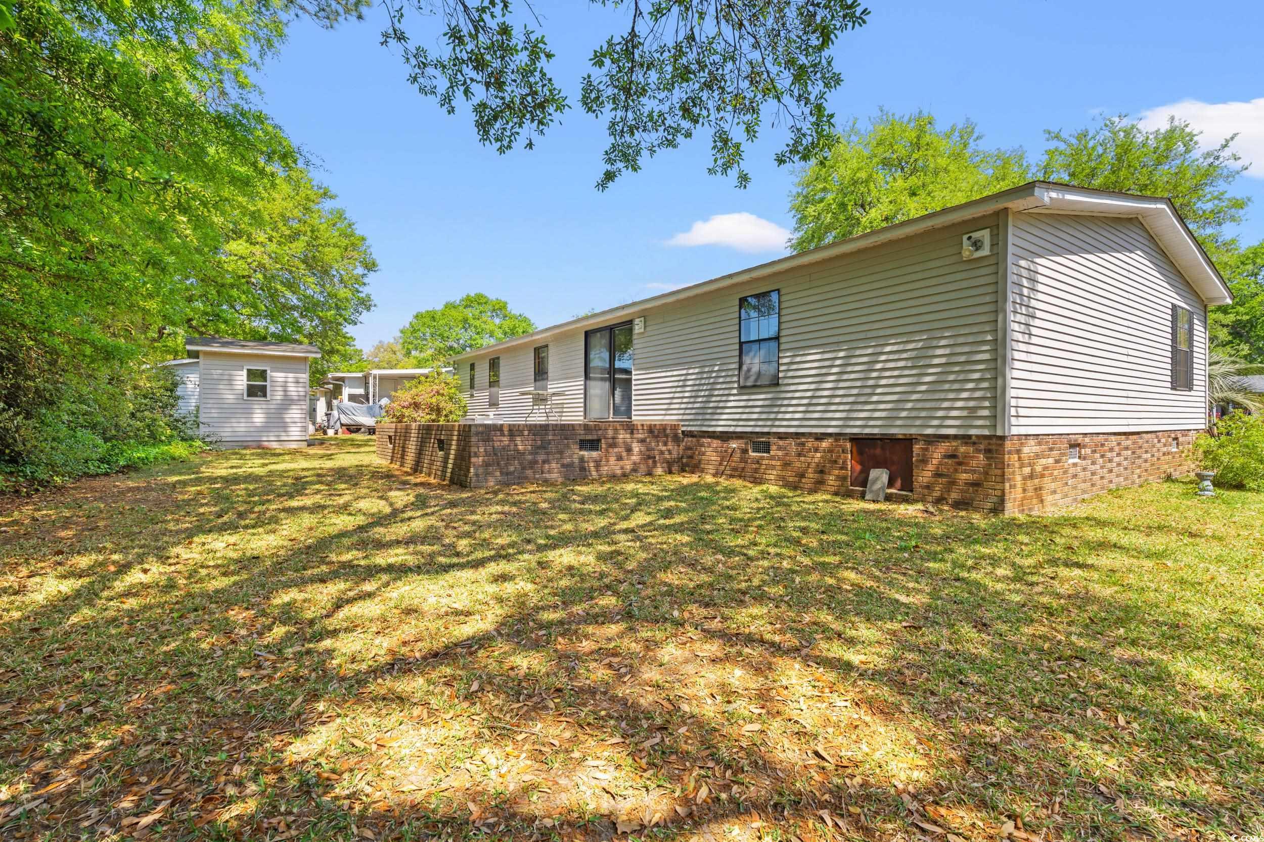 976 South Marlin Circle Murrells Inlet, SC 29576 - Photo 30 of 36 Back of property featuring crawl space, a lawn, an