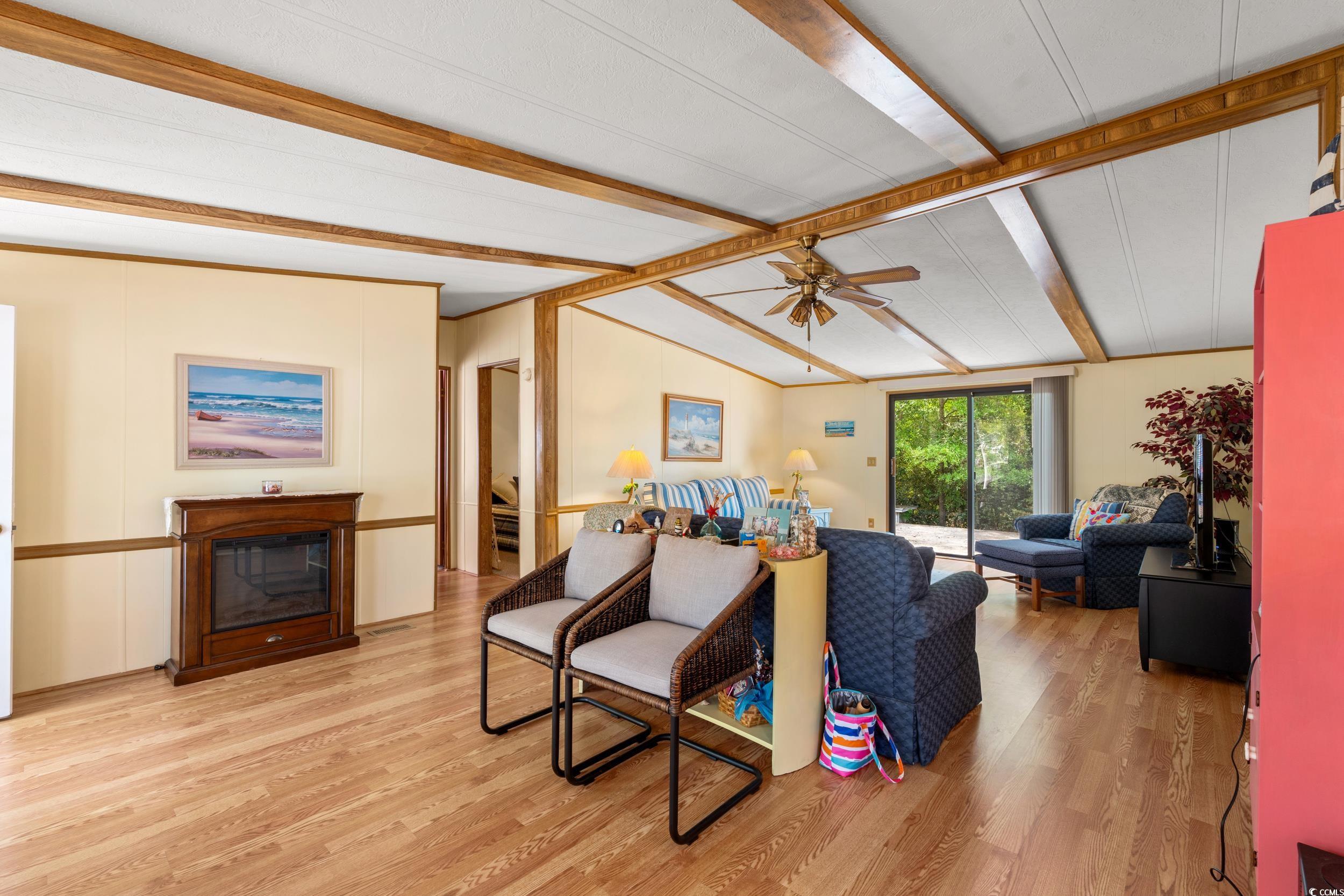 976 South Marlin Circle Murrells Inlet, SC 29576 - Photo 6 of 36 Living room with ceiling fan, lofted ceiling with