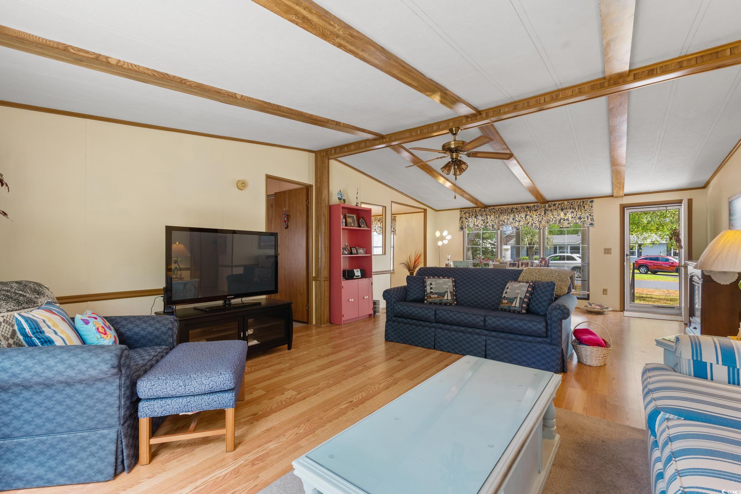 976 South Marlin Circle Murrells Inlet, SC 29576 - Photo 8 of 36 Living area featuring vaulted ceiling with beams,