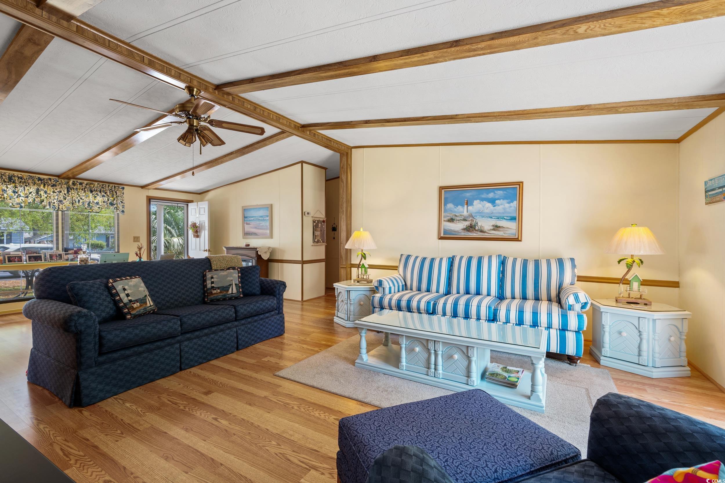 976 South Marlin Circle Murrells Inlet, SC 29576 - Photo 9 of 36 Living room with ceiling fan, wood finished floors