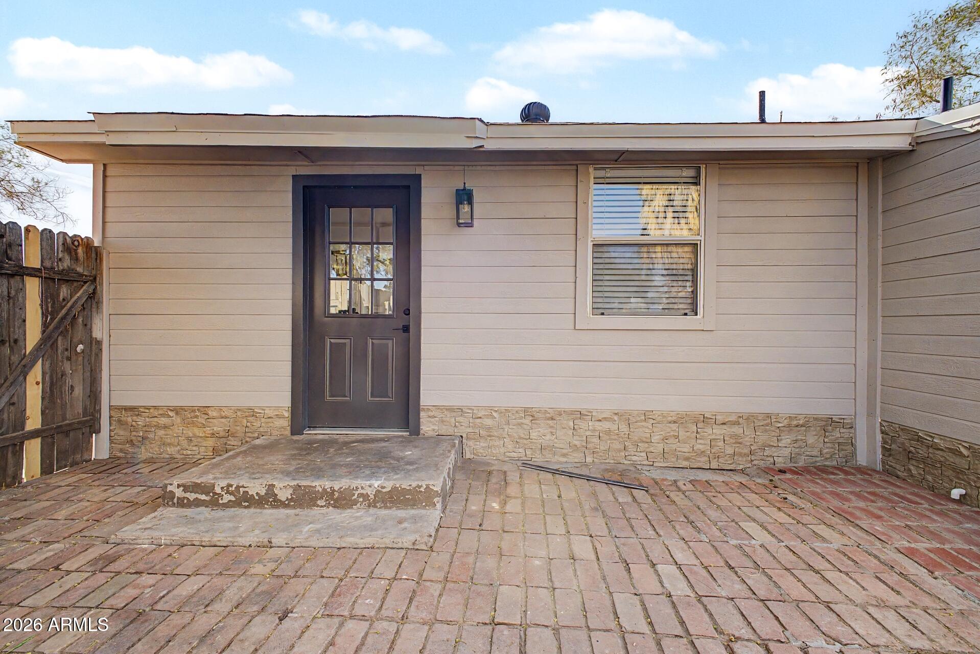 1914 East Monte Vista Road Phoenix, AZ 85006 - Photo 23 of 26 a front view of a house with a yard