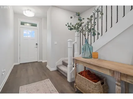 a bathroom with a balcony a bed and a mirror