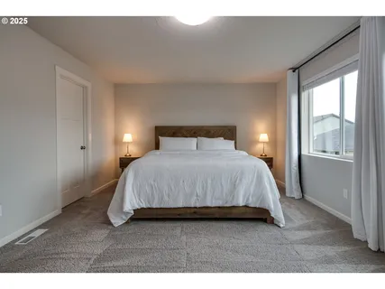 a bathroom with a granite countertop sink mirror and a bathtub