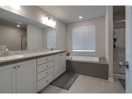 a bathroom with a bathtub and a sink