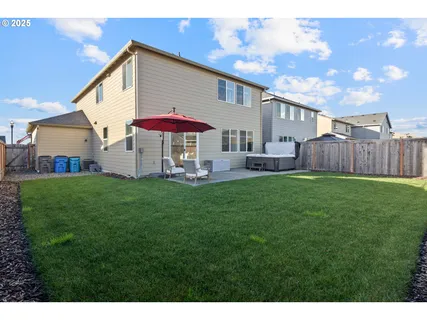 a front view of a house with a garden and pathway