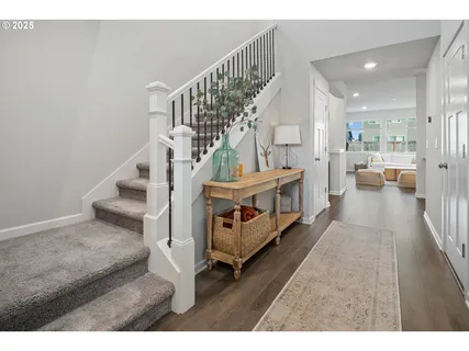 a view of an entryway with wooden floor