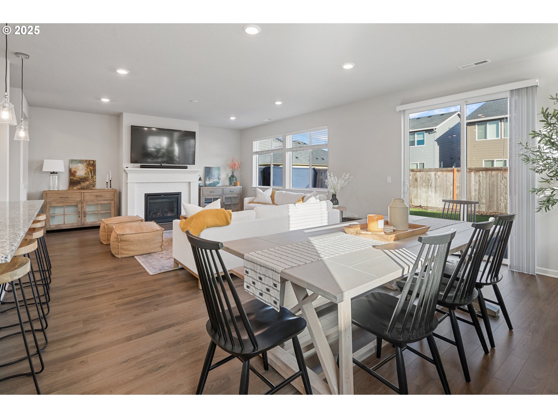 3812 South 41st Place Ridgefield, WA 98642 - Photo 9 of 30 a view of a dining room with furniture and wooden floor