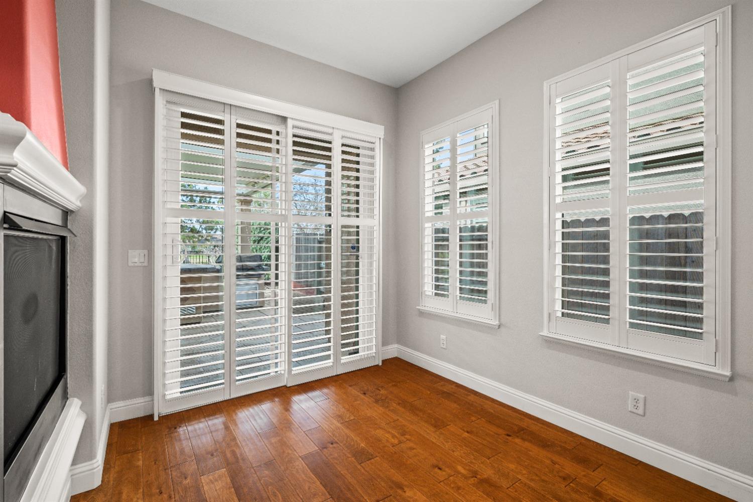 18040 Ruddy Street Woodland, CA 95695 - Photo 17 of 40 a view of an empty room with a window and wooden floor